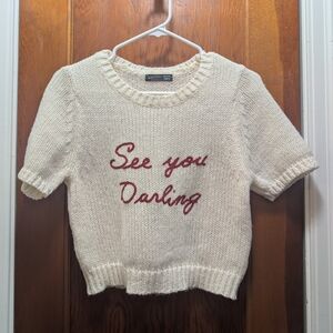 Chic Cream Sweater with Red Script